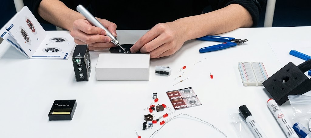 Student soldering electronics at RoboEDU Richmond